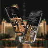Two smartphones displaying wedding invitation designs with a couple in formal attire against a blurred cityscape background.