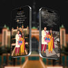 Two smartphones displaying a family photo with traditional attire against a blurred background of a temple.
